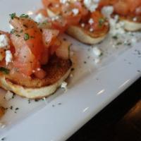 Bruschetta · Diced tomatoes and fresh basil marinated in a white balsamic vinegar, served on toasted
Ital...