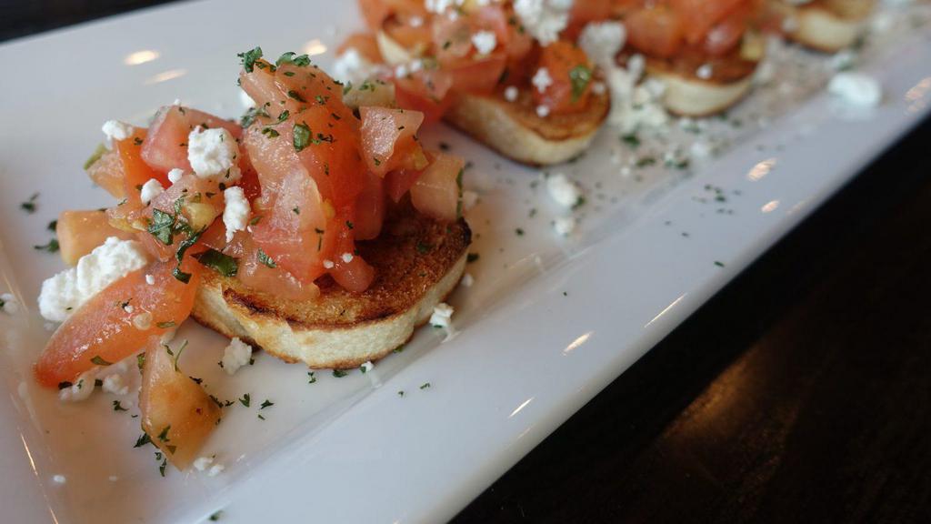 Bruschetta · Diced tomatoes and fresh basil marinated in a white balsamic vinegar, served on toasted
Italian bread topped with goat cheese.