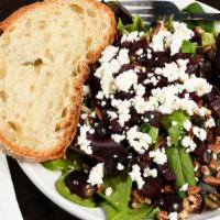 Field Greens · Fresh field greens, goat cheese, roasted beets, toasted
pecans and sliced red grapes with a ...