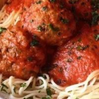 Spaghetti & Meatballs · Homemade meatballs with tomato sauce over spaghetti.