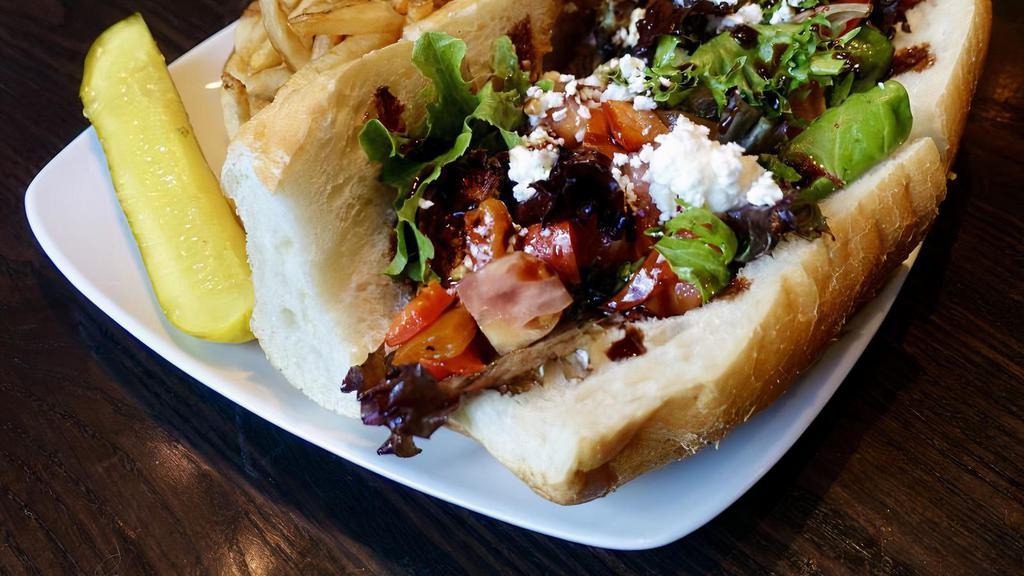 Spring Chicken Sandwich · Griddled marinated chicken breast, mixed greens lettuce, olive oil, red peppers, diced tomatoes, balsamic glaze, feta cheese and mozzarella cheese.