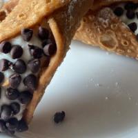 Cannoli · Deep fried pastry shell filled with sweetened
ricotta cheese and chocolate chips.