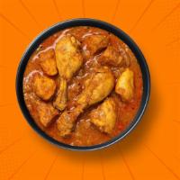 Capital Chicken Curry · Bone in chicken pieces simmered in a brown onion and tomato curry, seasoned with fresh herbs...