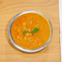Chana Masala · Chickpeas cooked with onions, tomatoes, potatoes, spices, and fresh herbs.