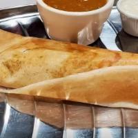 Masala Dosa · Crepe (made with lentil and rice flour) stuffed with potato masala, served with chutney and ...