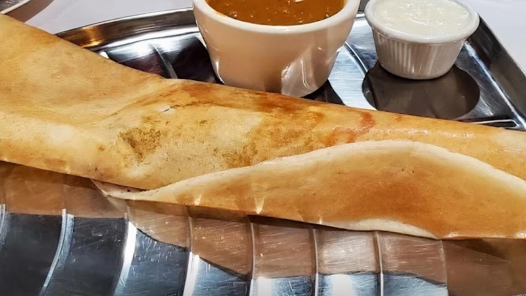 Masala Dosa · Crepe (made with lentil and rice flour) stuffed with potato masala, served with chutney and lentil soup.