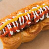 Downtown Haus Dogs · Smoked bacon dog, caramelized onions, pickled peppers, mayonnaise, mustard, and ketchup on a...
