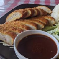 Ton Katsu · Pork cutlet breaded and deep fried. Comes with rice and salad.