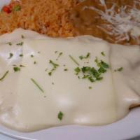 B. Beef Enchiladas · Two ground beef enchiladas topped with chili con carne, jack cheese. All plates served with ...