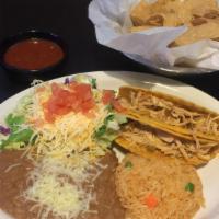 Tacos · Your choice of two crispy or soft, ground beef or spicy chicken. Served with rice and beans ...
