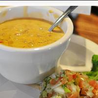 Tortilla Soup · Bowl of rich chicken broth with marinated chicken, tomato, roasted poblano peppers, jack che...