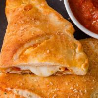 Napoli White Calzone · Ricotta cheese, mozzarella, roasted garlic, drizzled with extra virgin olive oil topped with...