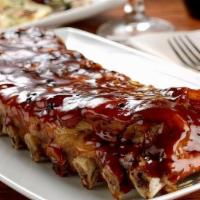 Costillitas De Cerdo · Grilled Pork Ribs with a choice of one side