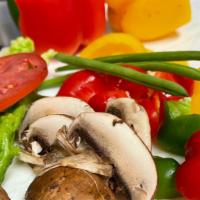 Garden Salad · Freshly prepared mix of Romain, tomatoes, cucumbers, red onions, bell peppers, Portabella mu...
