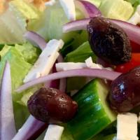 Greek Salad On Pita · Freshly chopped Romain garnished with fresh cut tomatoes, cucumbers, red onions, feta cheese...