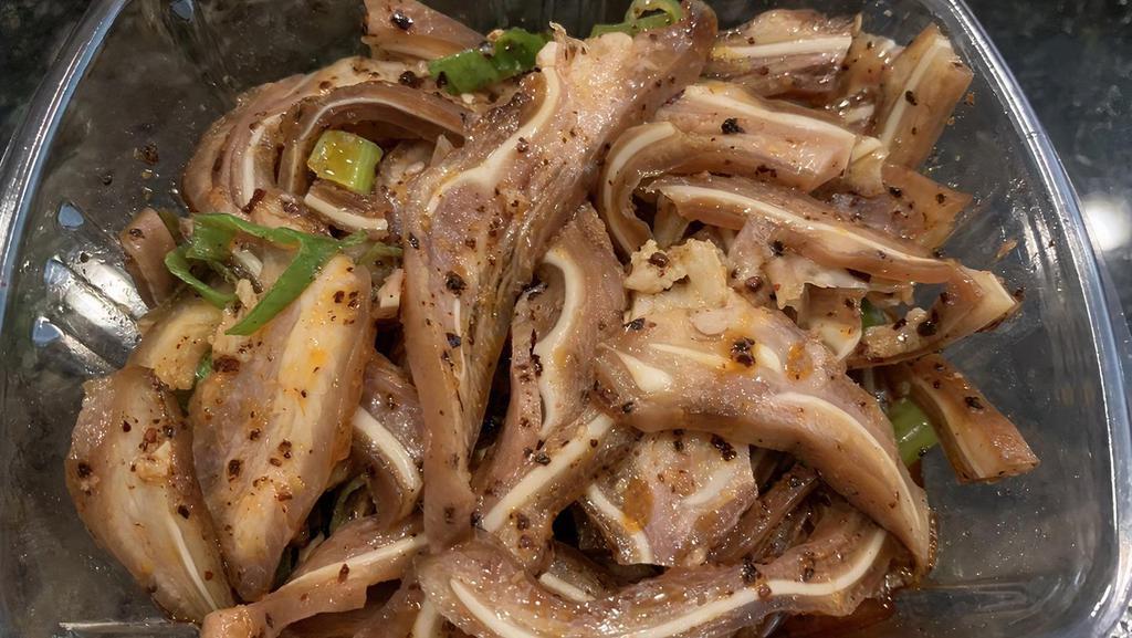 Shredded Pig Ear · Served in a chili oil sauce.