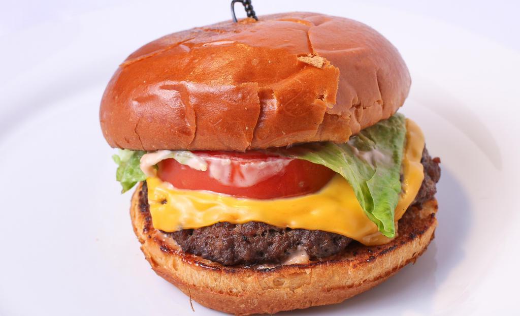 Ayva Burger · USDA Beef, lettuce, tomatoes. cheese, our special burger sauce, and pickles served with one side.