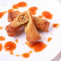 Vegetarian Eggrolls · Two pieces vegetarian eggrolls served with sweet chili sauce.