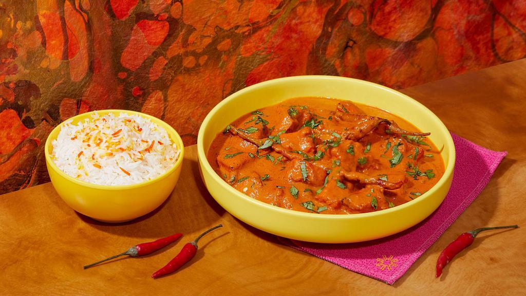 Chicken Tikka Masala · Spicy chicken in a creamy tomato sauce. with basmati rice