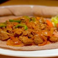 Sheba Tibs (Spicy Or Mild) · Beef tenderloin cubes sautéed with onions, fresh tomatoes, garlic, ginger, rosemary, jalapeñ...