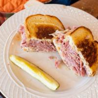 Hot Reuben (1/2 Lb.) · Grilled on rye bread with swiss cheese, sauerkraut and thousand island dressing.