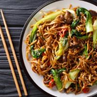 Combo Yaki Udon · Thick, soft udon noodles stir fried with chicken, beef, shrimp, and veggies in flavorful sau...