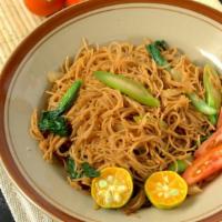 Singapore Noodles · Rice noodle stir fried with chicken, jumbo shrimp and vegetables topped with curry flavor.