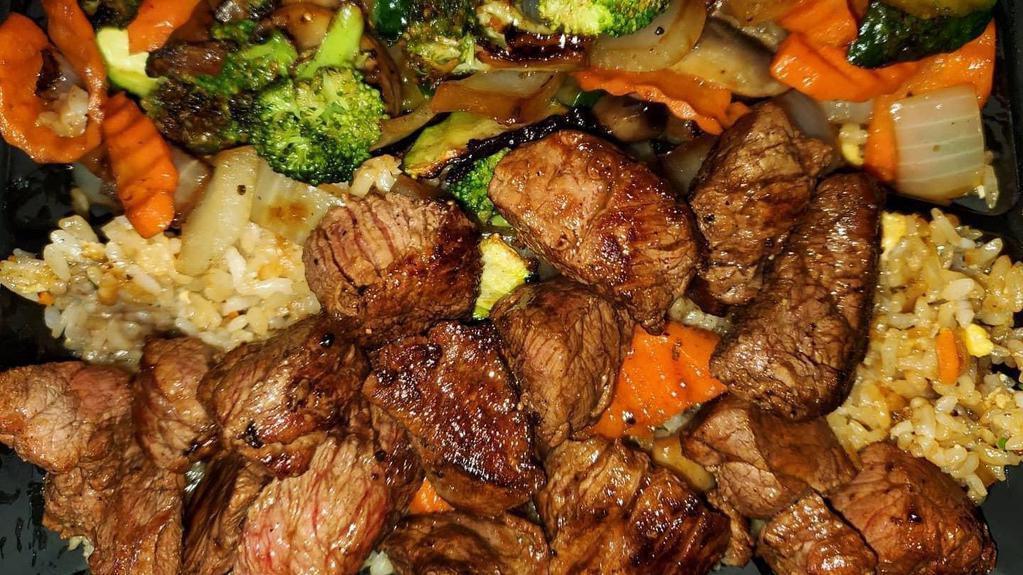 Filet Mignon · Filet mignon served with vegetables and rice.