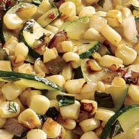 Charred Corn & Zucchini  · Cotija cheese, pepitas and tajin spice.
