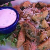 Buddy'S Fried Pickles · Diced dill pickle spears, hand battered, fried, and garnished with parmesan cheese. Served w...