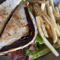 Pete’S Club · Layers of turkey, ham, bacon, lettuce, tomato provolone, and American cheese on toasted marb...