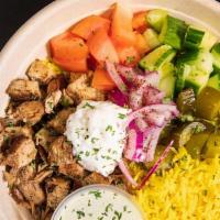 Rice Bowl · Your choice of shawarma chicken or falafel over rice with hummus, tomatoes, onions, pickles,...