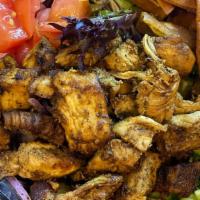 Chicken Fattoush Salad · Mixed greens, chicken, tomatoes, onions, cucumber, pita chips & fattoush dressing.