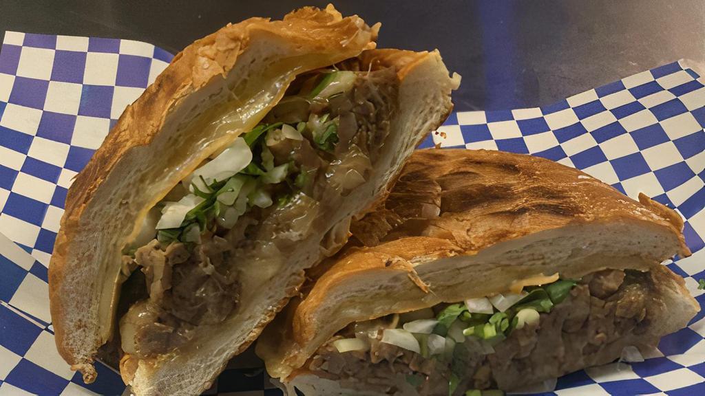 La Taquera · Your choice of meat blended with white cheese, mayo, cilantro, white onions, and our Signature Salsa Verde