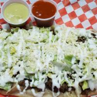 Huarache · Popular fried masa oblong shape tortilla with refried beans, shredded lettuce, Mexican cream...