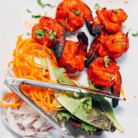 Tandoori Shrimp · Shrimp mildly marinated with garlic, cilantro and black pepper.
