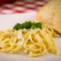 Fettuccine Alfredo · Egg noodles in a cream sauce topped with parmigiana cheese.