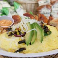 Vegetarian Omelette · Spinach, onions, tomatoes, corn, mushrooms, and mozzarella. A 3 egg omelette served with hom...