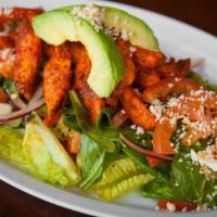 Red Chicken Salad · Marinated chicken, lettuce, spinach, avocado, queso, onions, and tomatoes with a dressing of...