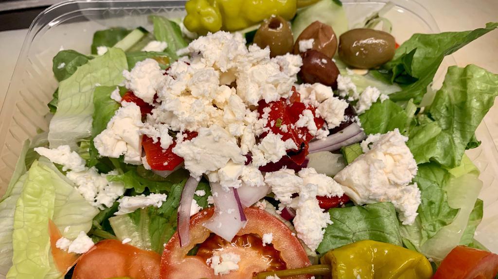 Greek Salad · Romaine lettuce, tomatoes, pepperoncini, onions, cucumbers, calamata olives, feta cheese.