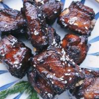Auntie Ying Bbq Ribs · Deep fried pork short ribs with special house bbq sauce and freshly fried mint