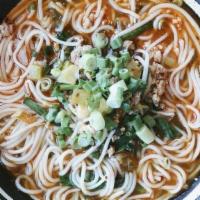 Xiao Guo (Pork) Rice Noodle · Spicy Level 3. Minced tender pork in a slow-cooked pork broth laced with homemade garlic-chi...