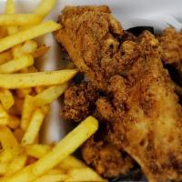 Seasoned Wings · Four crispy whole wings seasoned and breaded with our house spices;; accompanied by french f...