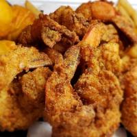 Shrimp Basket · Six jumbo seasoned and breaded shrimp, three homemade hush puppies, and crispy french fries ...