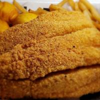 Fish Basket · Two 6 oz in-house seasoned and breaded Swai fillets, three homemade hush puppies, and crispy...