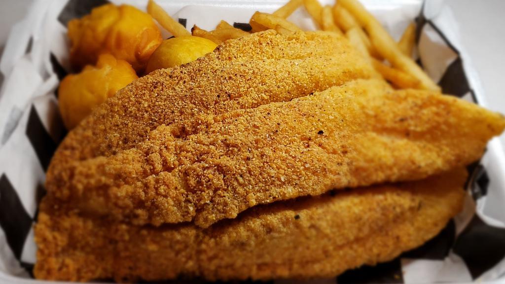Fish Basket · Two 6 oz in-house seasoned and breaded Swai fillets, three homemade hush puppies, and crispy french fries seasoned with a house-made blend.