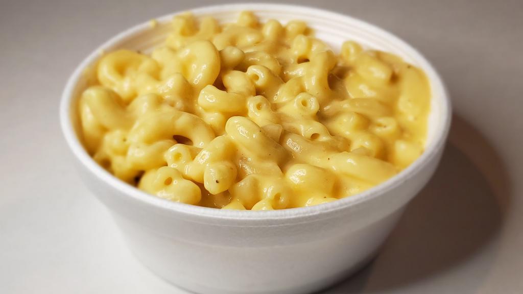 Macaroni & Cheese · Macaroni in our creamy house made cheese fresh and made to order.
