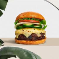Caliente Pepper Vegan Burger · Seasoned 100% Beyond burger topped with jalapenos, melted vegan cheese, mustard, ketchup, le...