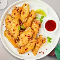 Sweet Spice Wings · Fresh vegan chicken wings breaded, fried until golden brown, and tossed in sweet chili sauce...
