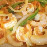 Poblano Shrimp · Shrimp in a poblano sauce with rice, beans & tortillas